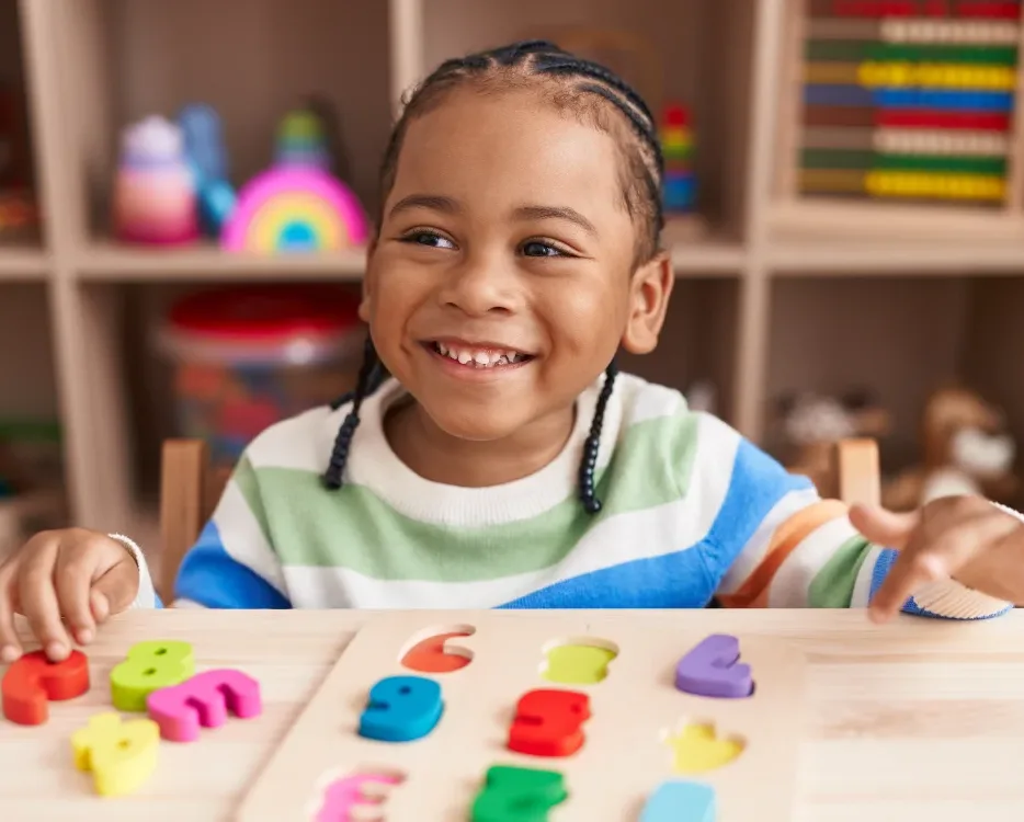 child smiling in classroom